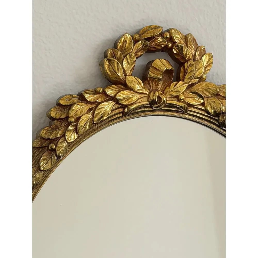 Vintage Hollywood Regency style mirror gold classic leaf wreath and ribbon crest